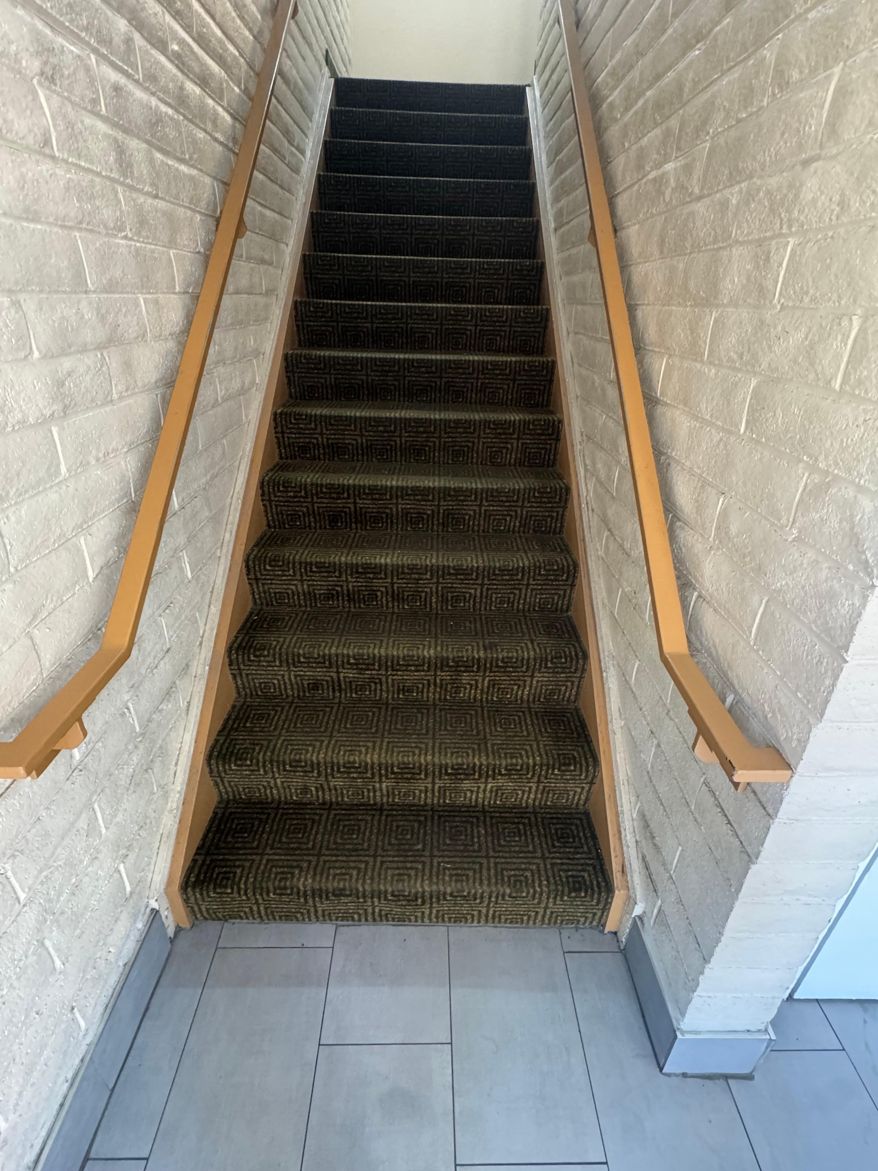 The stairwells are sticky with trash compacted into it.