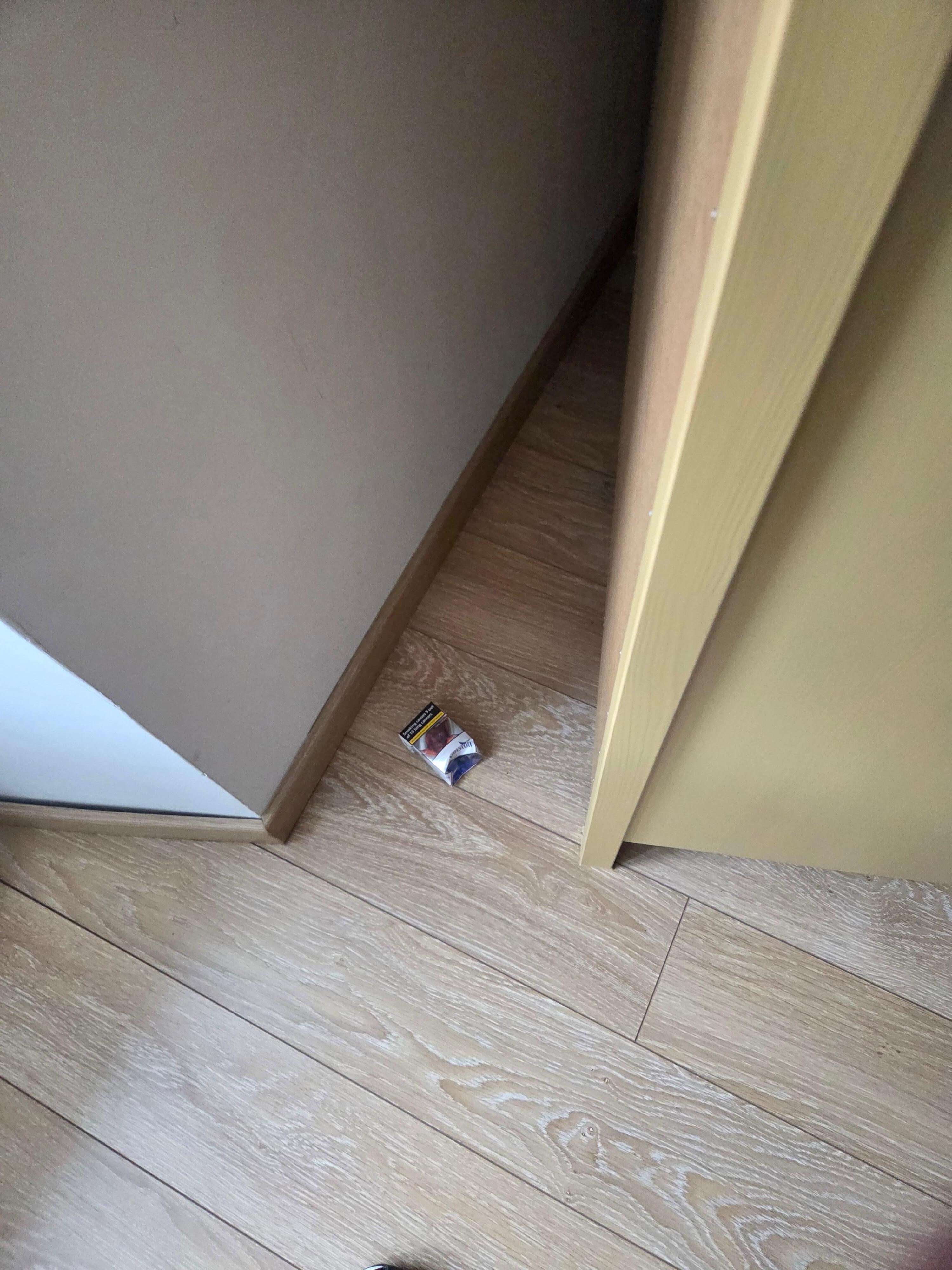 Cigarette pack under dresser