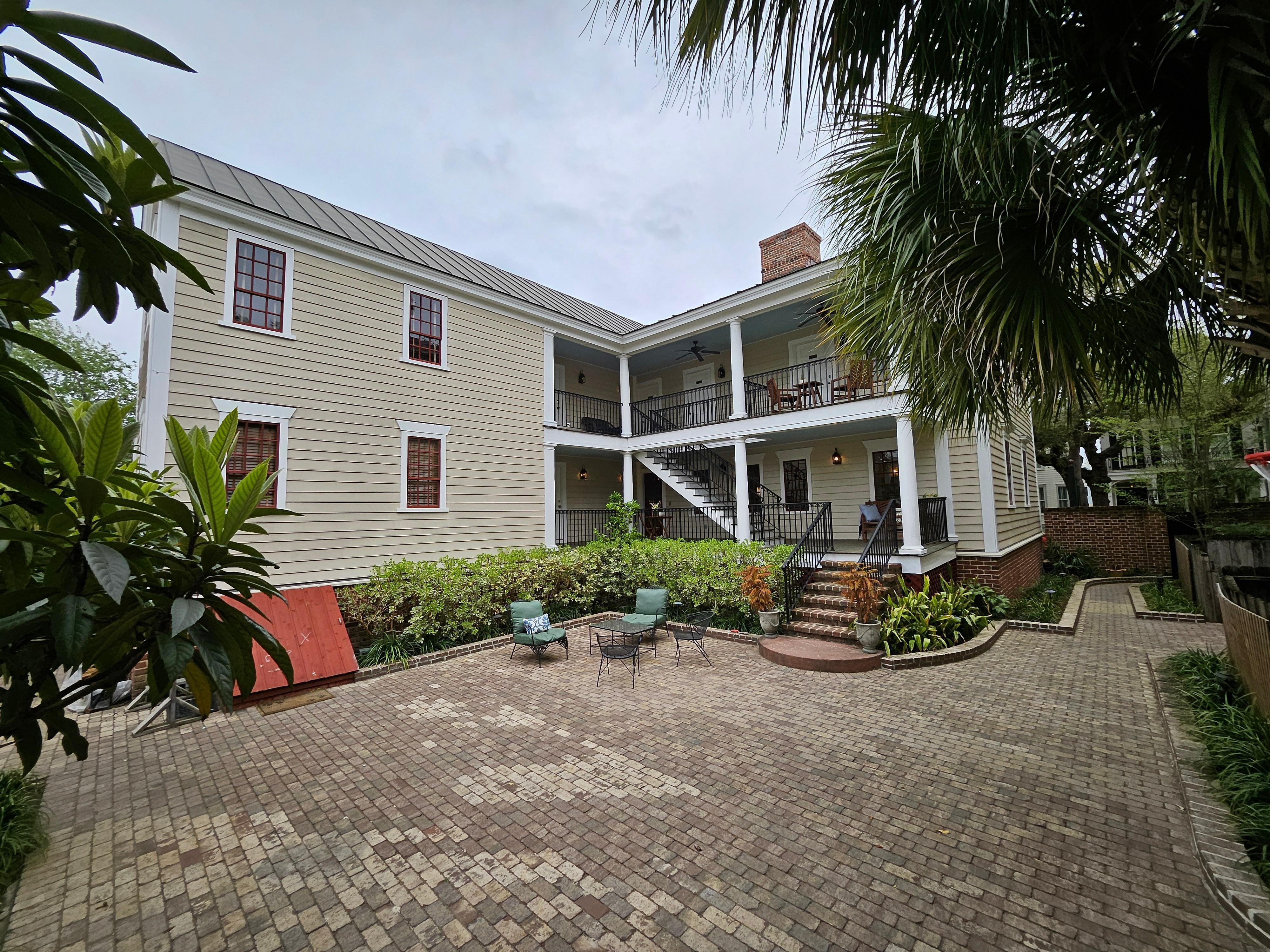 Back patio and stairs to second floor and attic rooms.