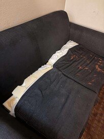 The sofa was dirty and broken, making the space feel neglected and unsanitary.