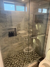 Nice glass shower maybe add a squeegee to keep glass clean during stay..