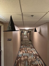 Cool hanging witch hats in the hallway.