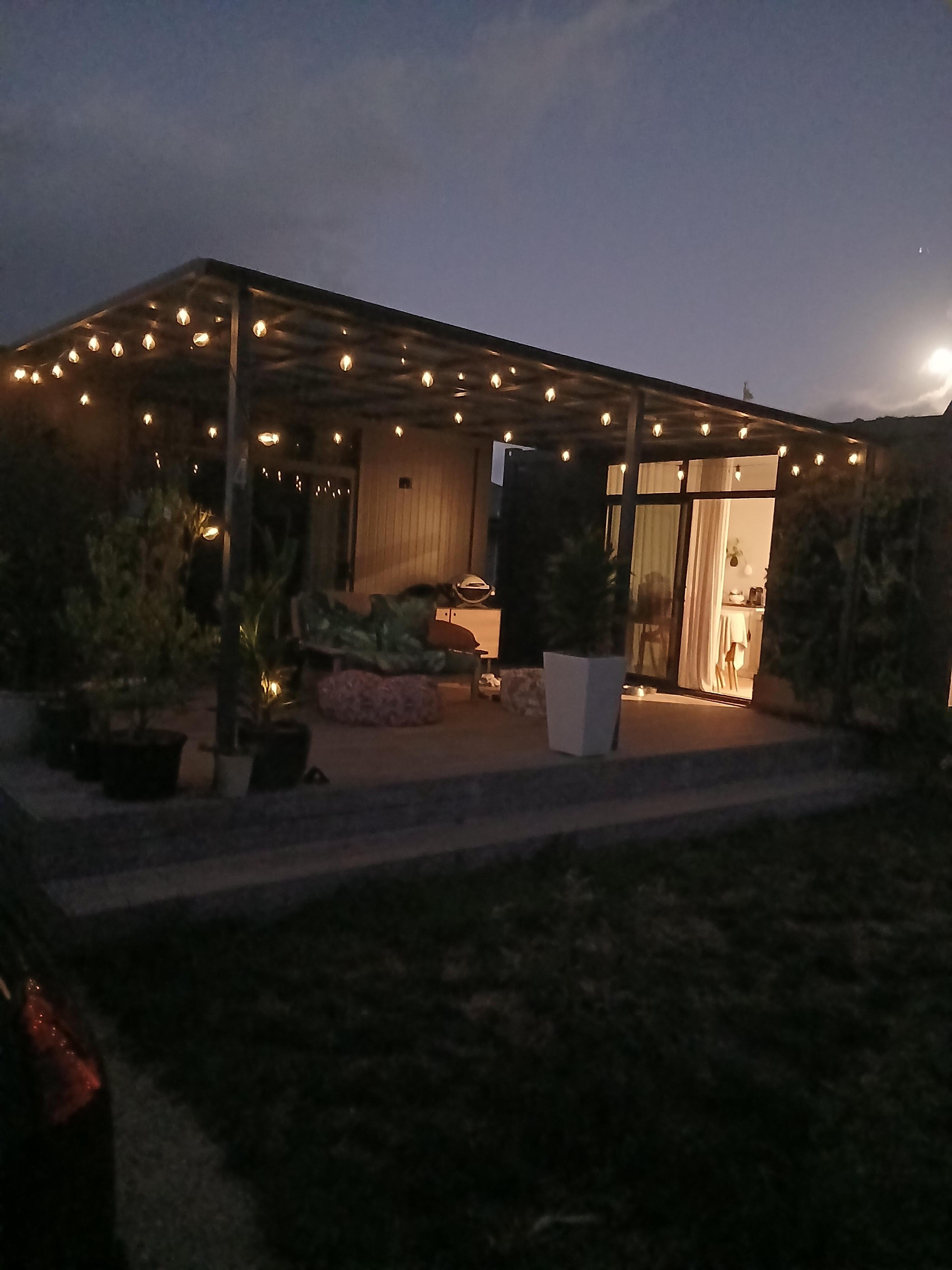 The cosy pod at night with the lights