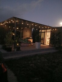 The cosy pod at night with the lights