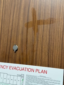 Door had a cross drawn on it, maybe with holy water.