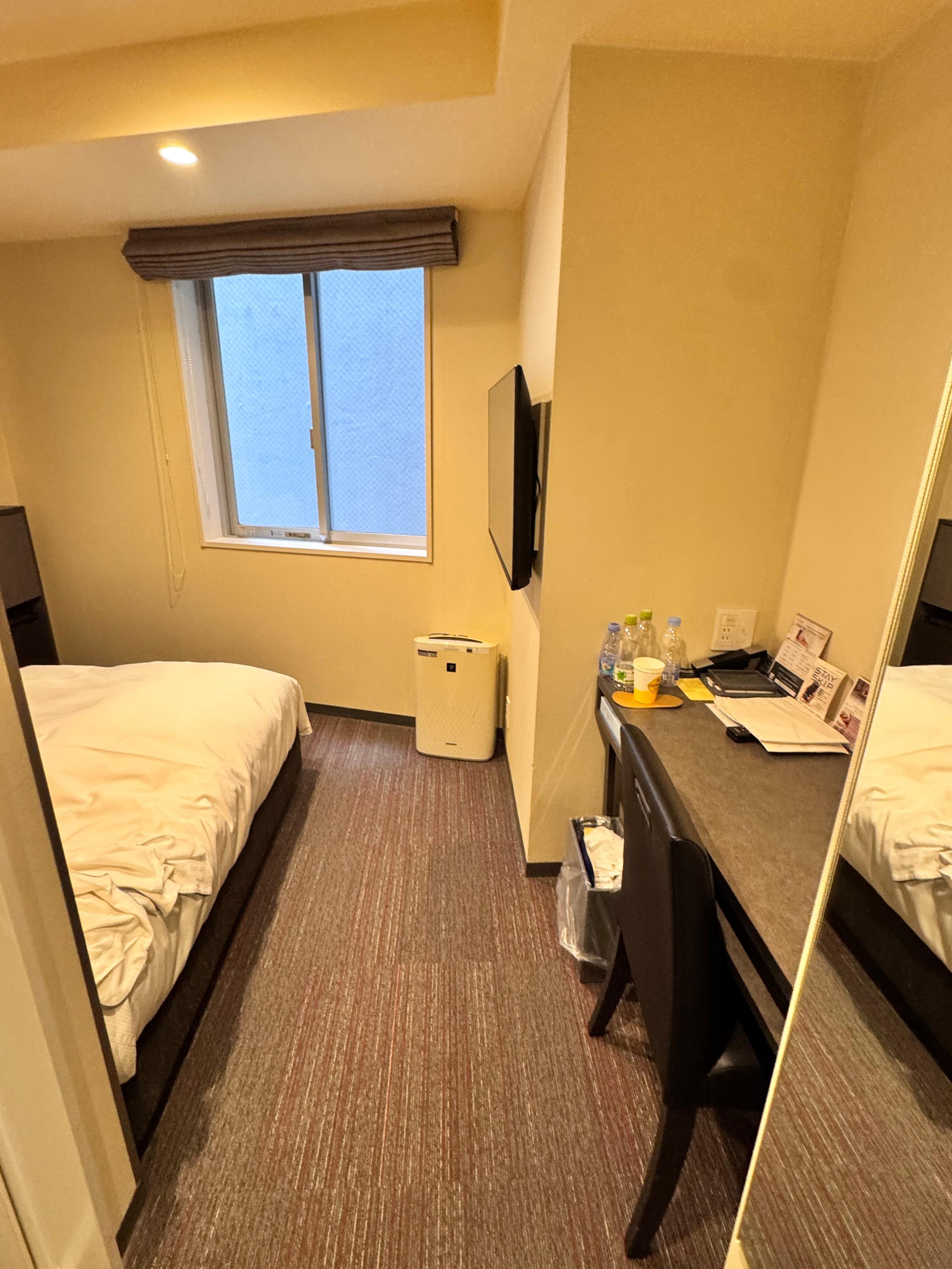 As you can see, there is not much space between the bed to the window. The window can be opened with a limit. 