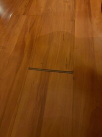 Hotel room floor with big gap