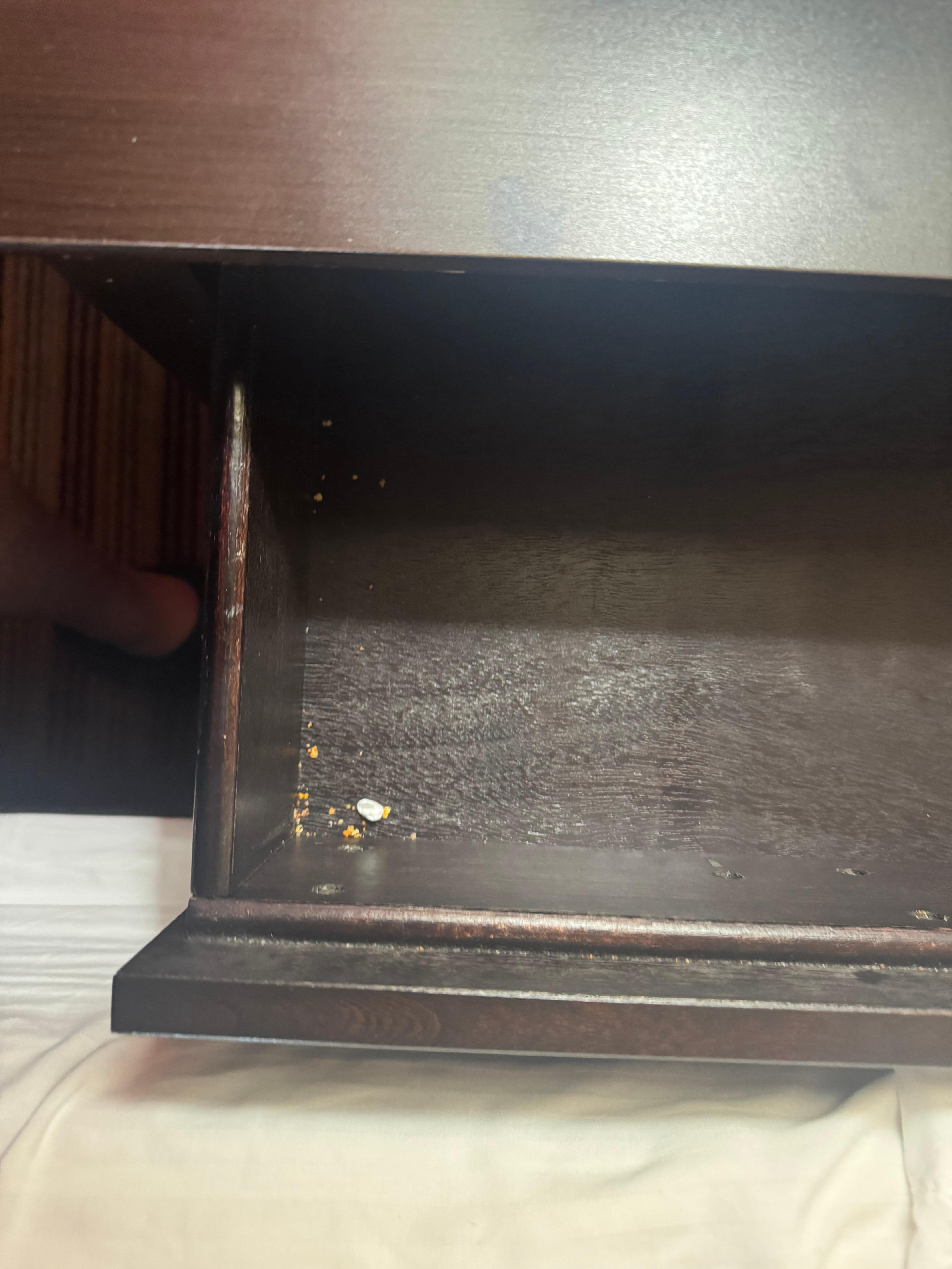 Nightstands still had food crumbs in them.