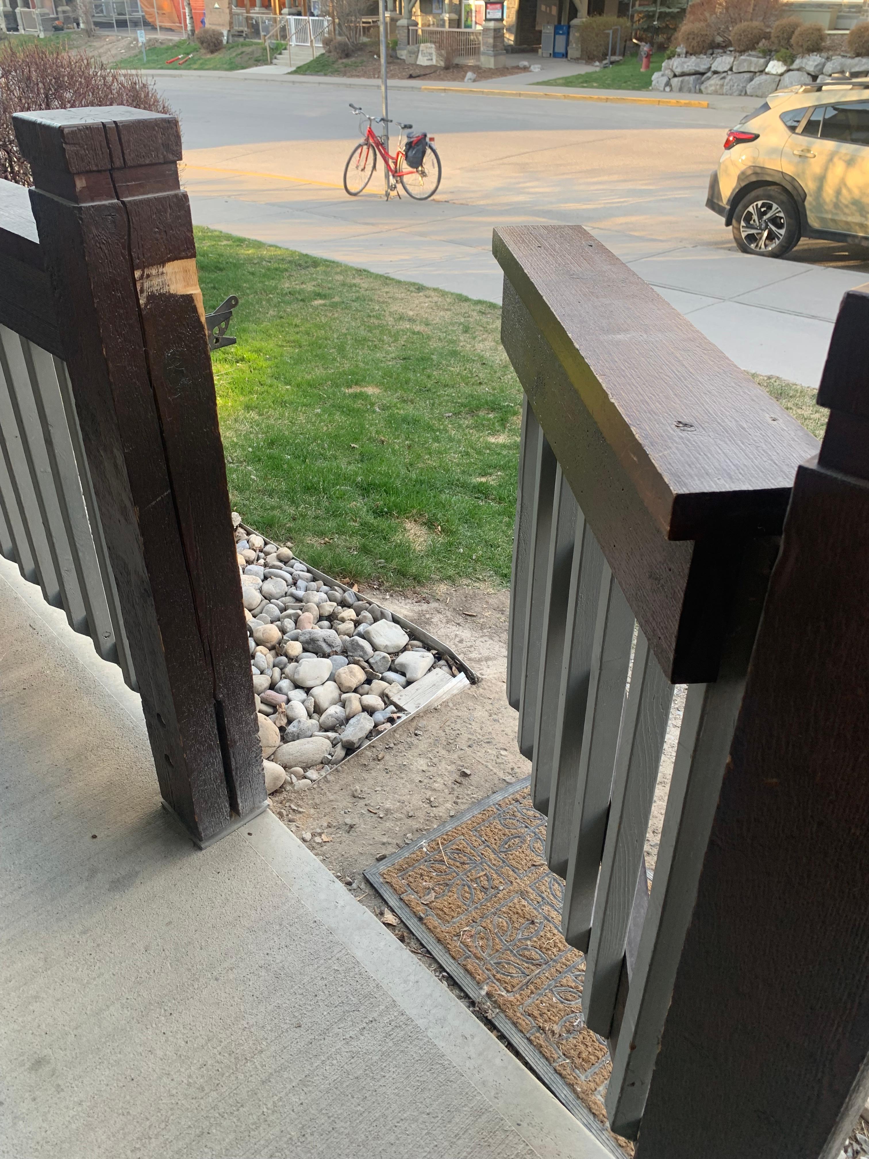 The gate leading off the patio. 