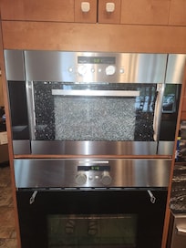 Shattered Microwave front, and broken handle on stove. This needs replaced/updated.