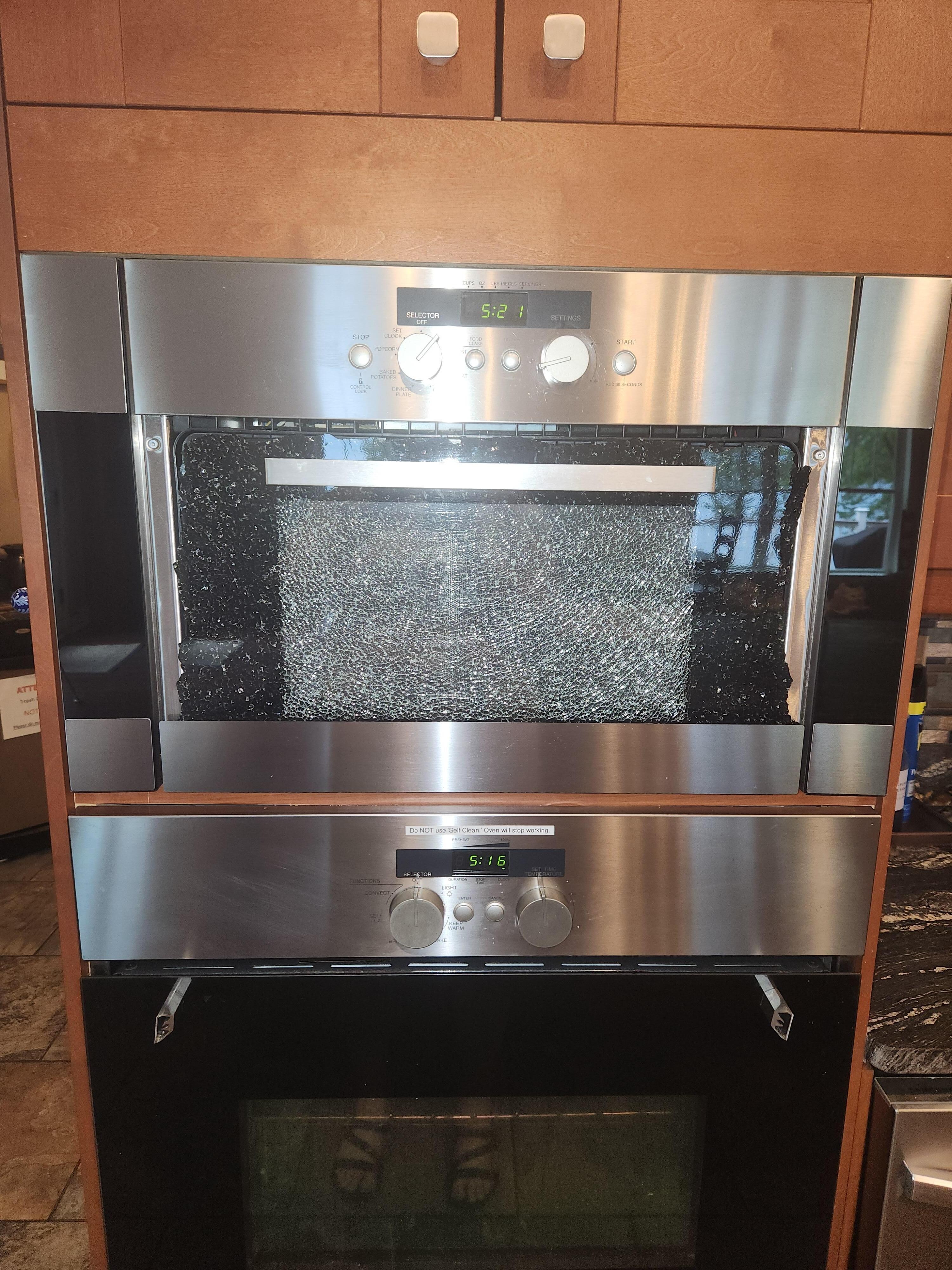 Shattered Microwave front, and broken handle on stove. This needs replaced/updated.