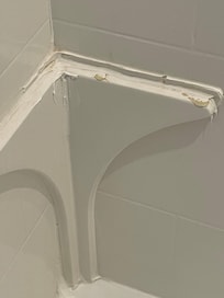 Broken foot rest in the shower