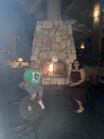 Relaxing by the fireplace.
