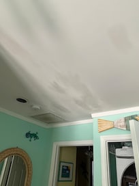 Older water damage that had been painted over.