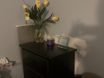 Wall not painted behind bureau.