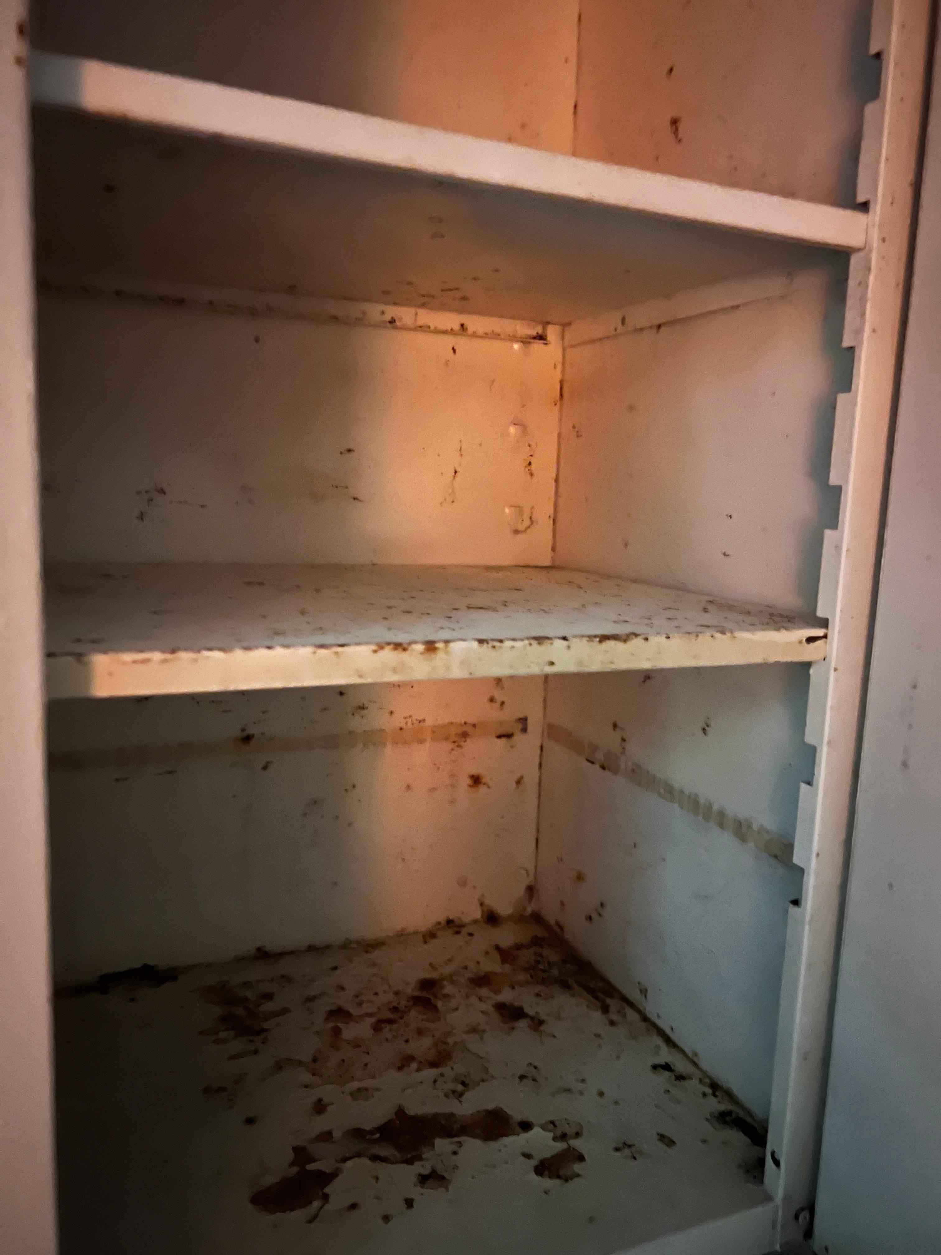 Rust filled Kitchenette cabinet