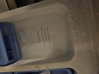 Washing machine dispenser with pool of water.