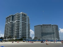 Both resort towers from beach view