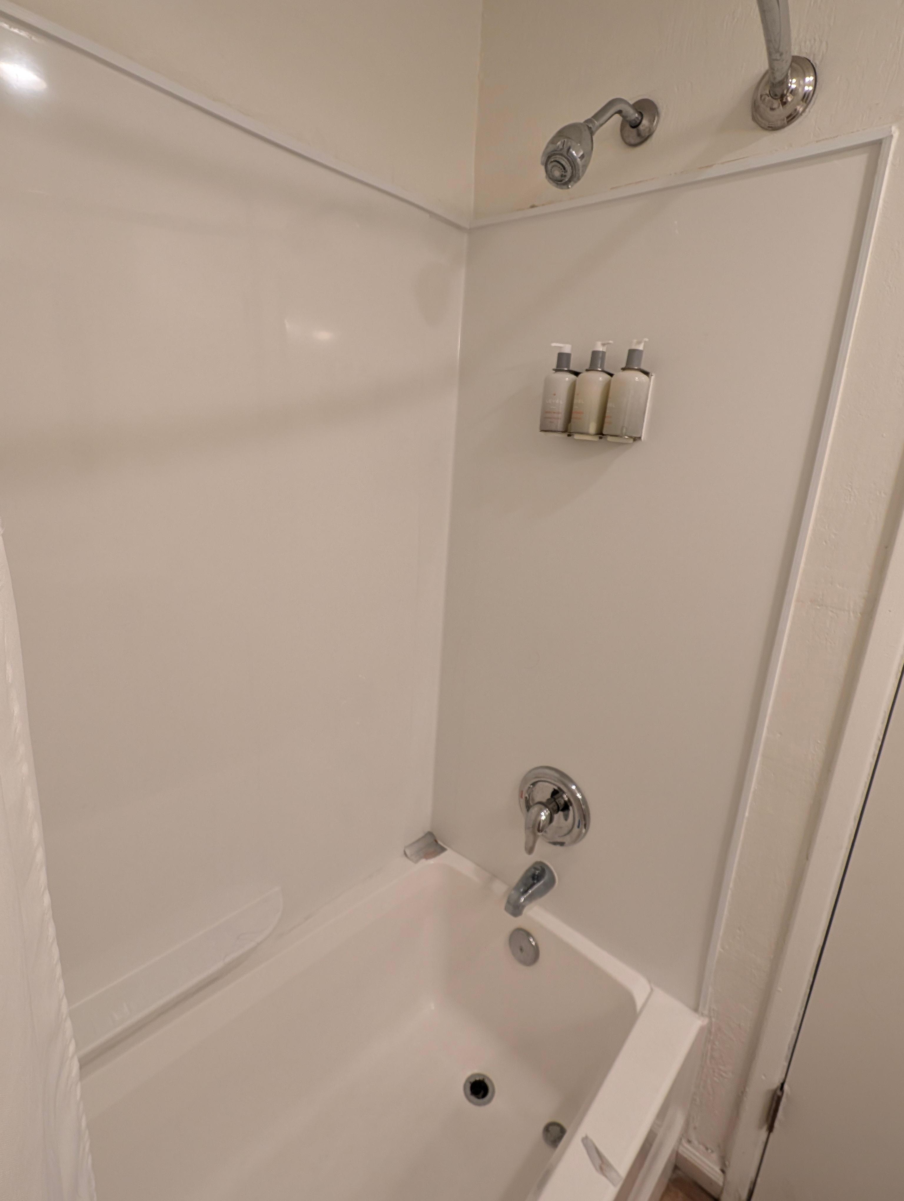 Broken drain, old shower head 