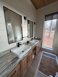 Both bathrooms are identical. Dual vanities and plenty of storage! Bedrooms also have huge walk in closets and access to the deck! Tall windows throughout to let in all the natural light.