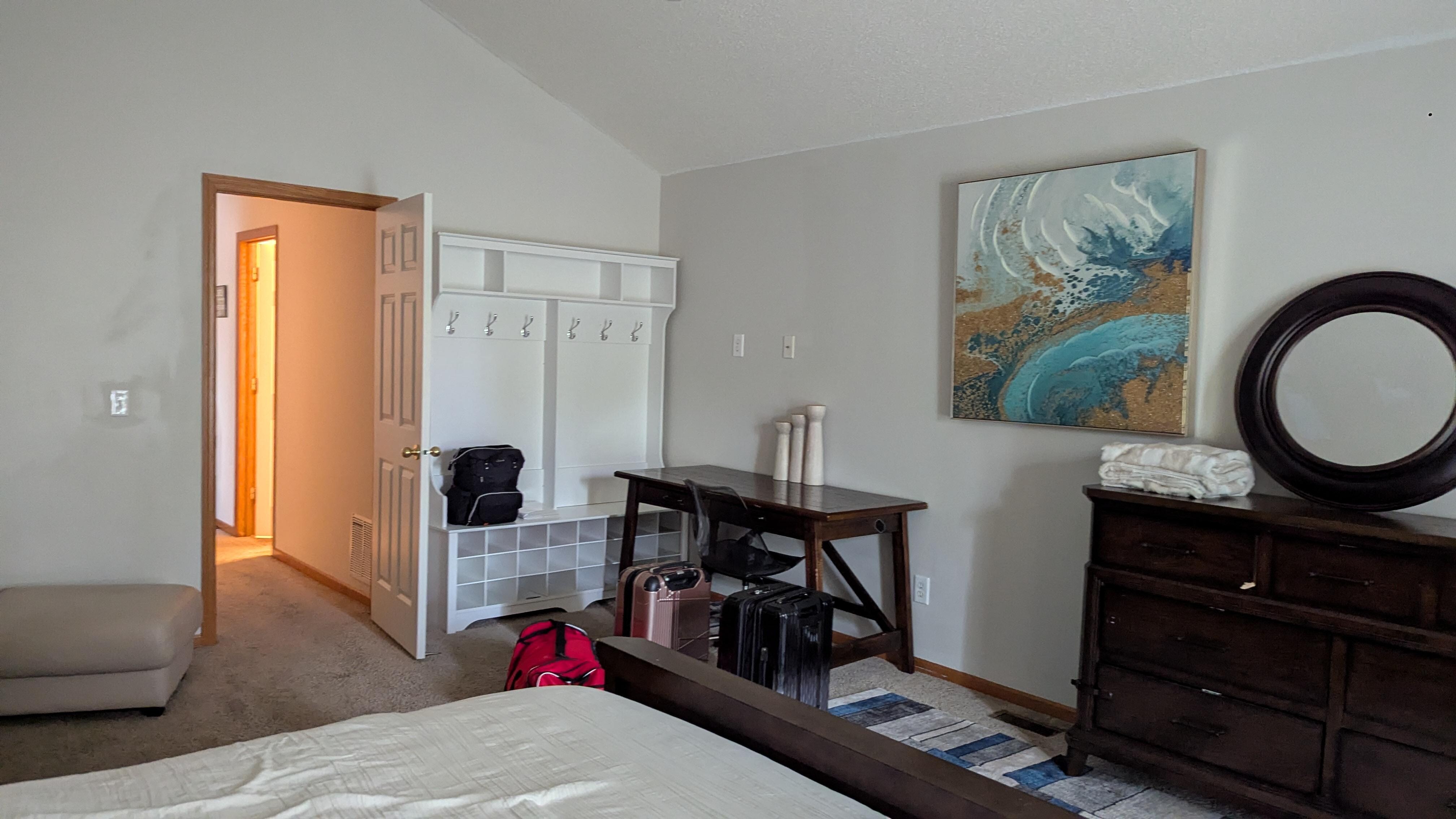 No closet in the bedroom but a bench with hooks