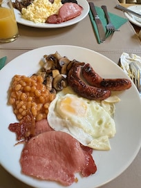 Breakfast minus the tomato and black pudding available. Cereal and yoghurt available with croissant and toast