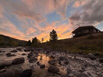 Sunrise over the house from the creek