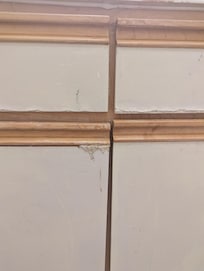 Bathroom cabinet. I have no idea what the "stuff" is clinging to the side but it did not appeal.