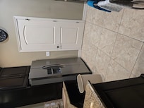 Kitchen- fridge has icemaker.