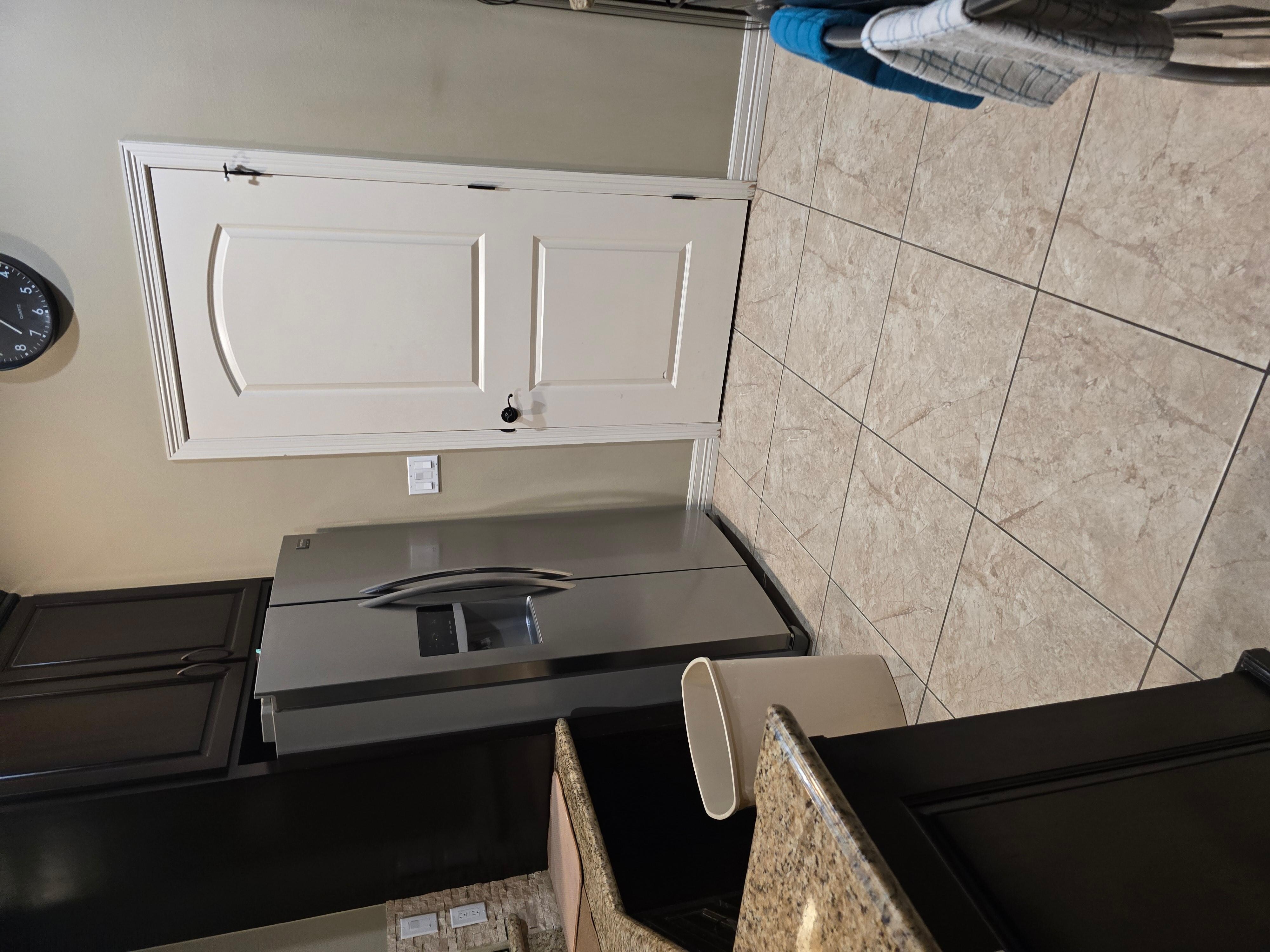 Kitchen- fridge has icemaker. 