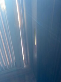A/C unit was not attached. Could easily be pushed in from the porch.