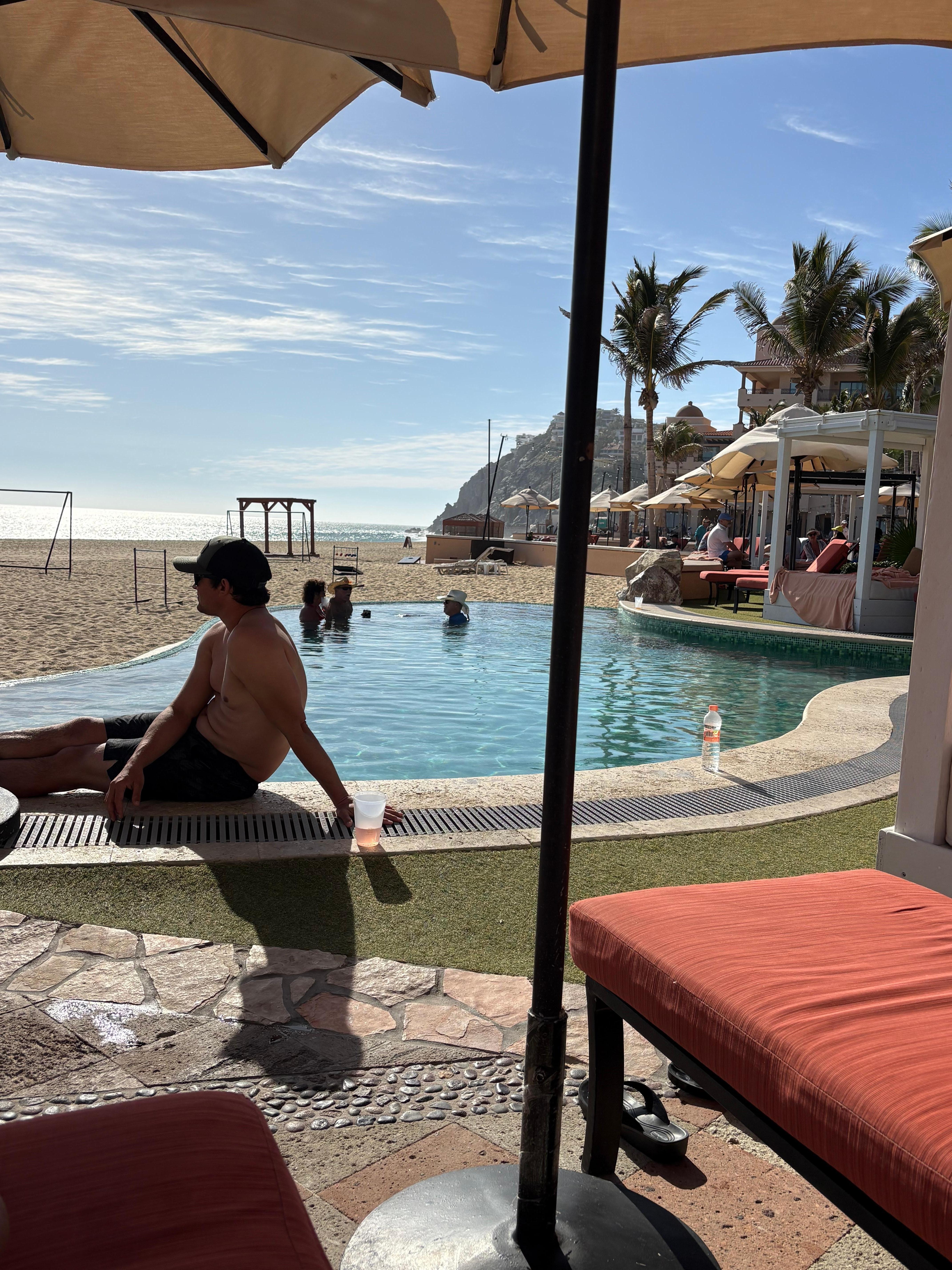 Overlooking beach and swim up bar pool.