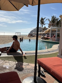 Overlooking beach and swim up bar pool.