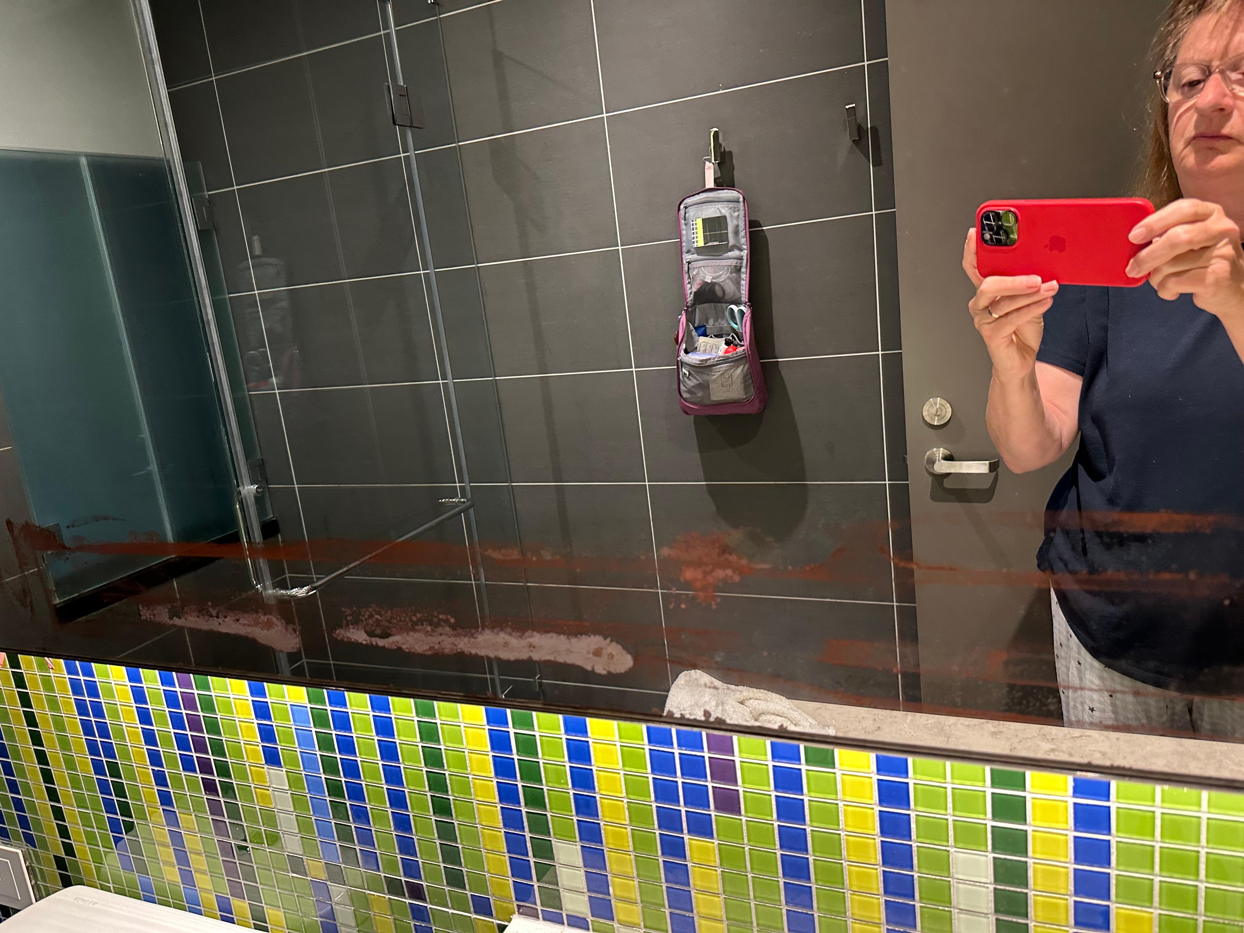 Bad condition of mirror in bathroom. Badly tarnished.