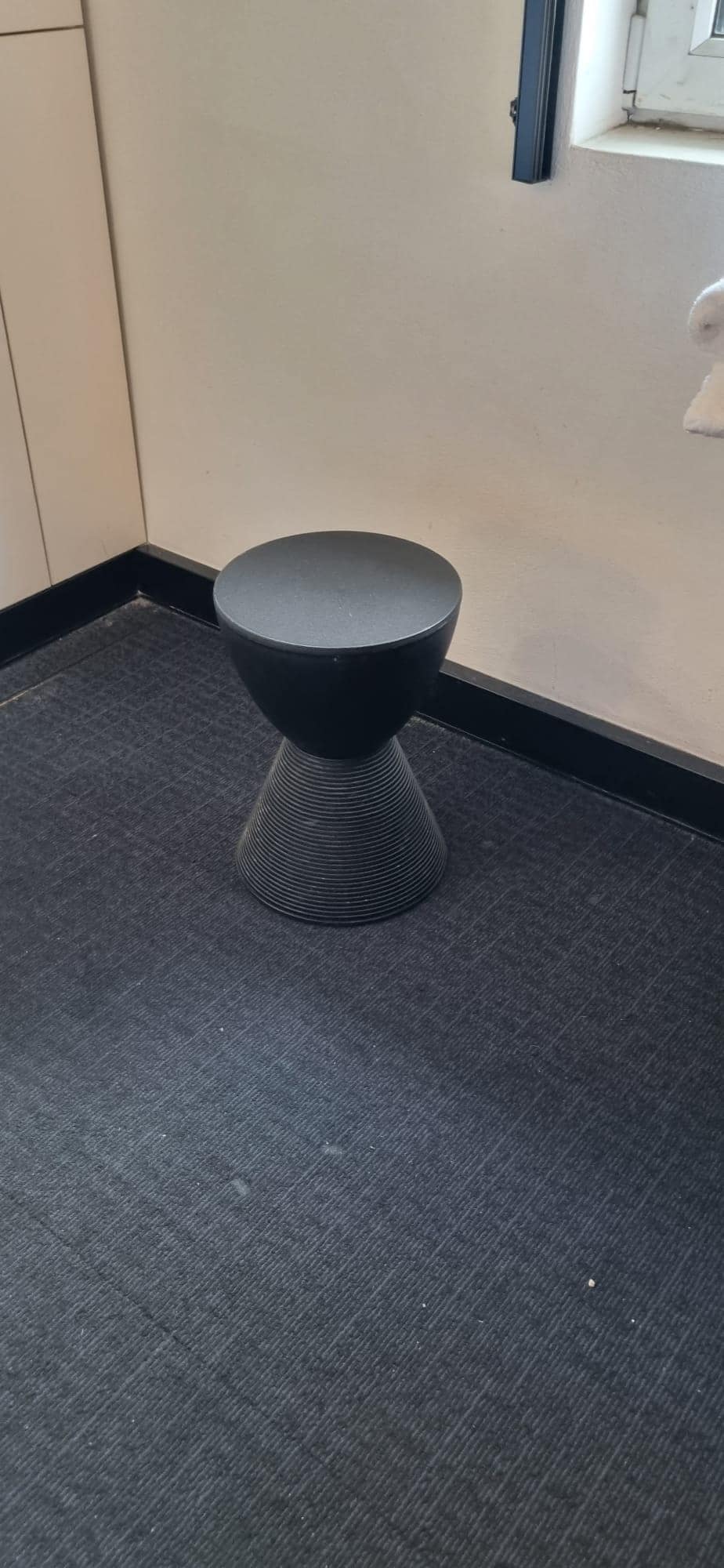 Wipe-clean stool, doesn't look like it has ever been cleaned