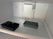 Dirty freezer. Only ice trays available so you will need to buy ice to use.