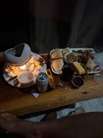 Fondue and wine pack with a cheese platter.
