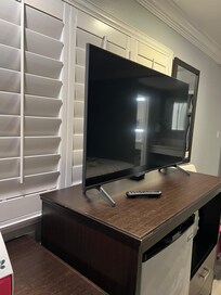 Average TV with fridge, microwave and safe.