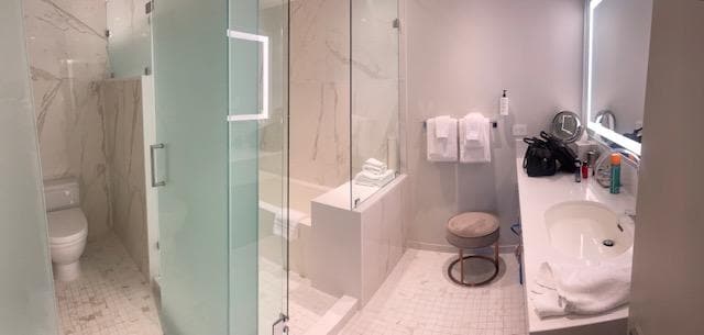 Out of this world bathroom with marble and counter.