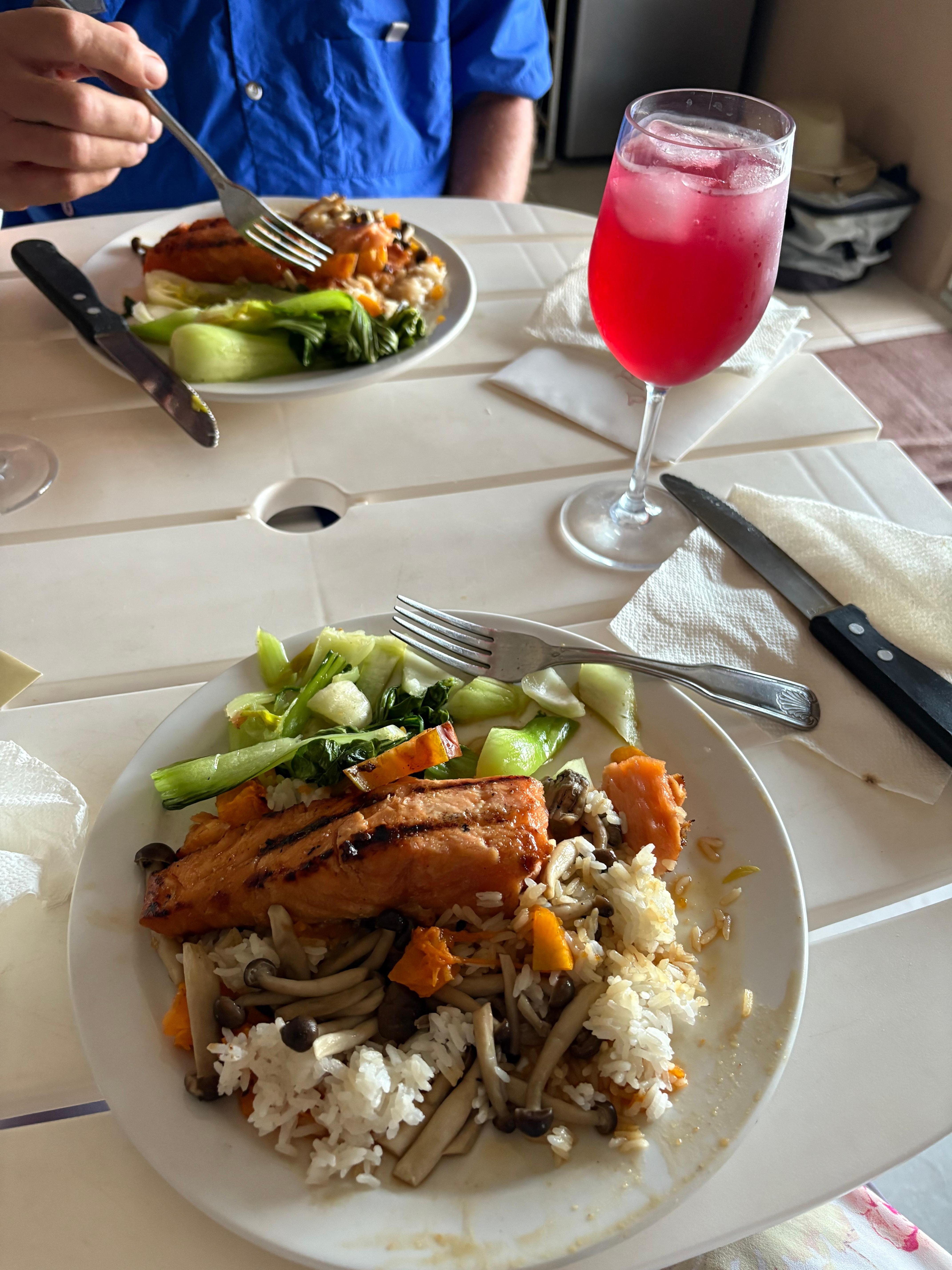 Salmon steak on rice over vegetable; steamed choy