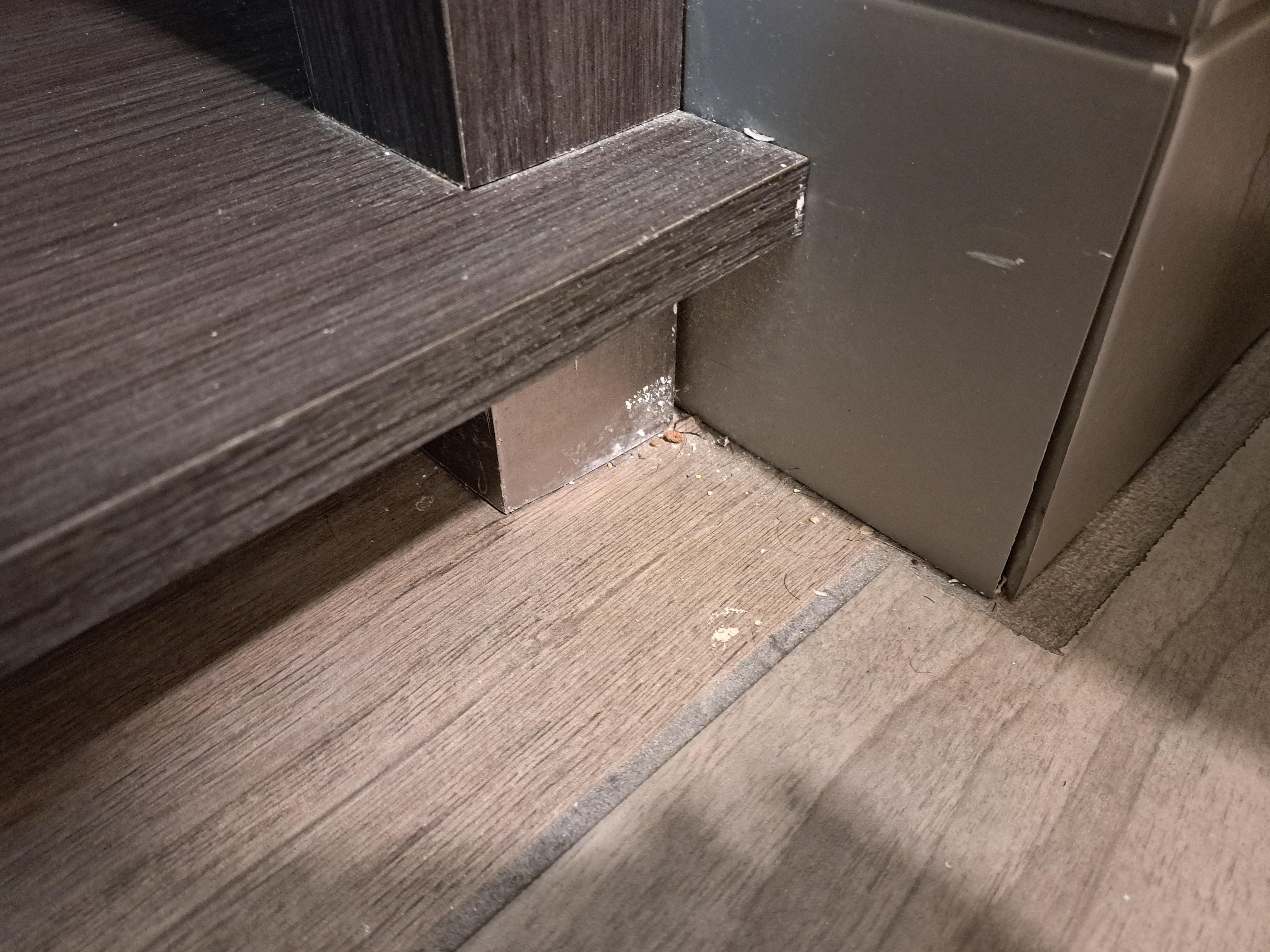 Dirt at base of vanity