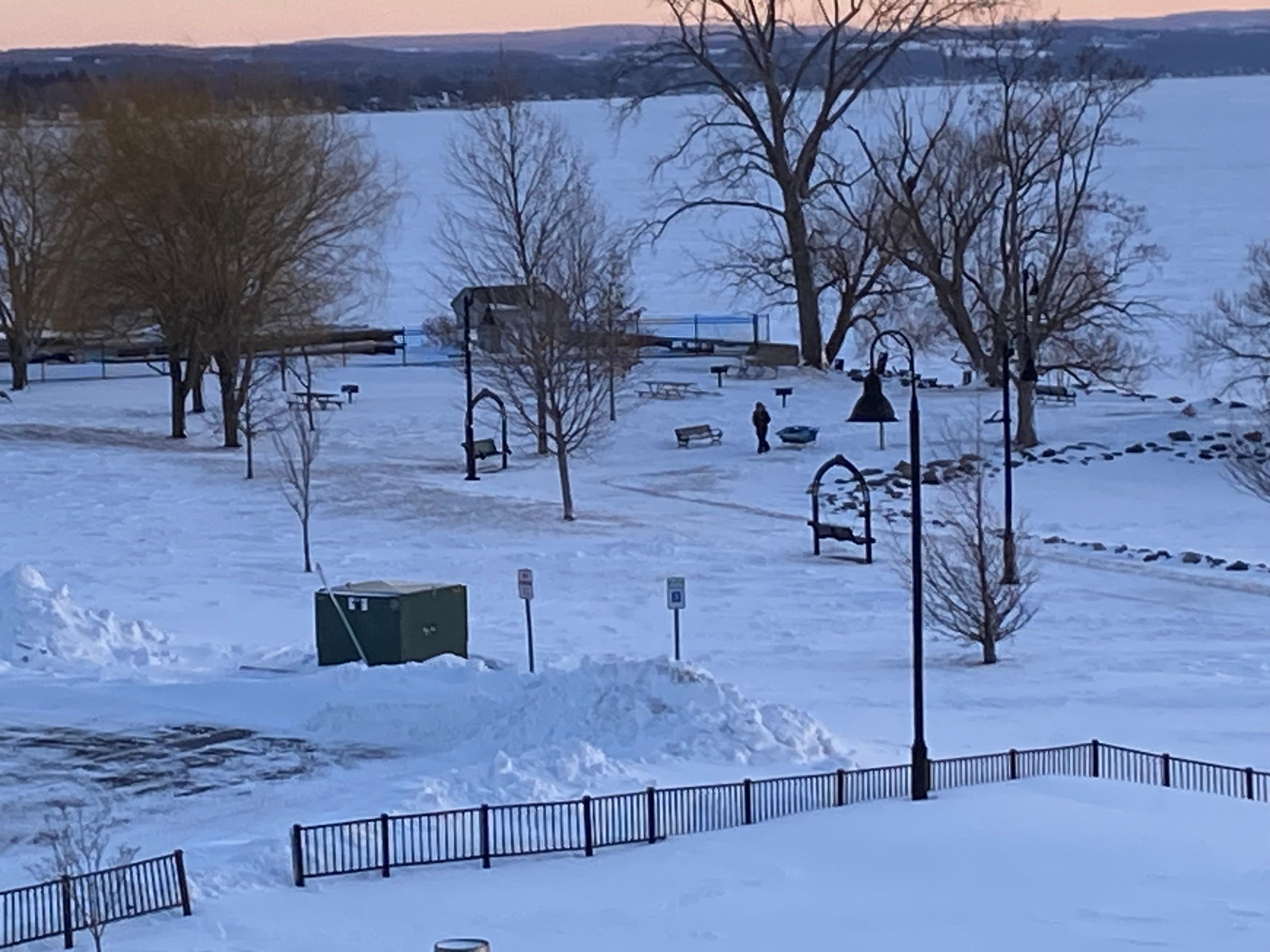 Frozen Canandaiga Lake there was a man ice fishing. Watched him and others walk back and forth. 