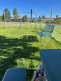 The other end of the dog park has a bench and picnic table!