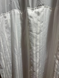 shower curtain was in poor condition with snags all over and dirty